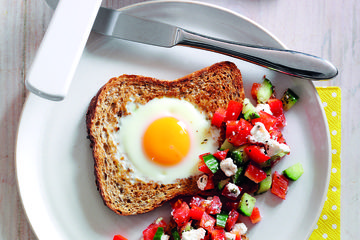 Egg in a toast with tomato and feta