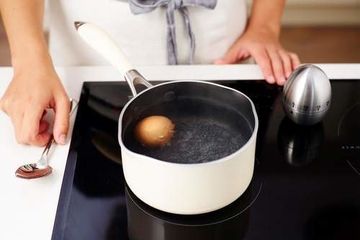 Boiled egg in saucepan